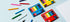 Colorful pencils and sets on a light blue background