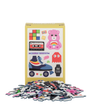 Pile of colorful puzzle pieces in front of a box with illustrations on a white background