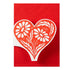 White floral heart design on a red card