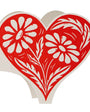 Red heart-shaped decorative item with white floral patterns on a white background