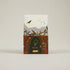 Sheval product packaging with a design of birds and a door on a beige background