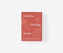 Red card deck packaging with 'Creative Thinking Cards' text on a white background
