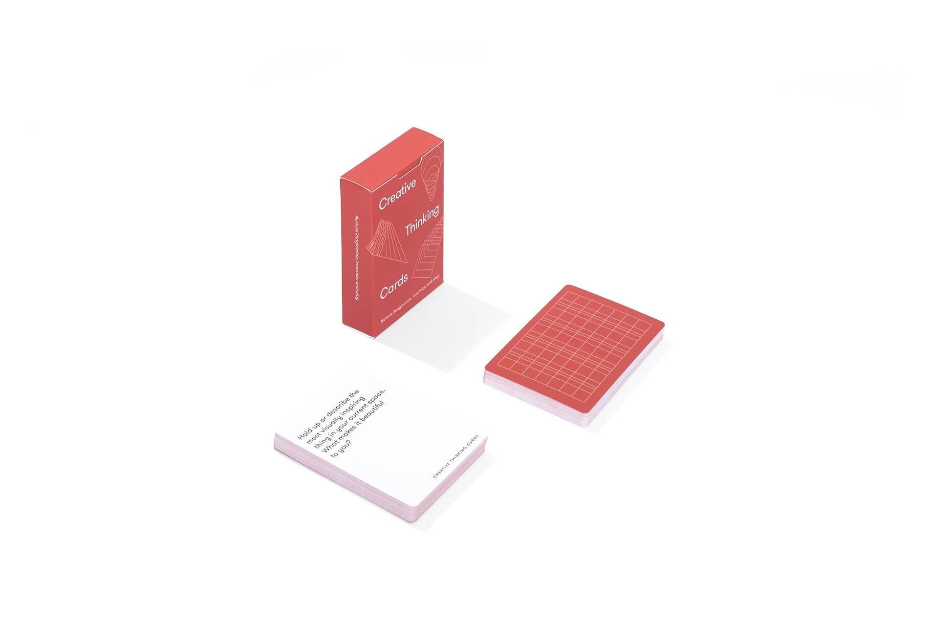 Red playing cards with grid design on a white background
