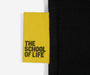 Yellow label with 'The School of Life' text on a black background