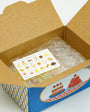 Open cardboard box with a plastic-wrapped item and a card inside, on a white background