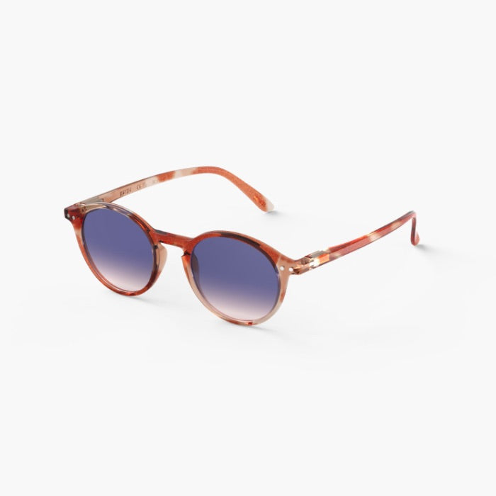 Sunglasses with a tortoiseshell frame and blue gradient lenses on a white background