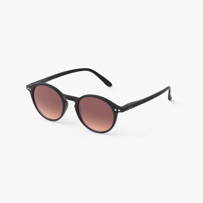 Black sunglasses with brown gradient lenses on a white background