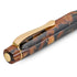 A close-up of a luxury pen featuring a polished tortoiseshell resin body with brown and black mottled patterns, accented by a gold-plated clip and trim.