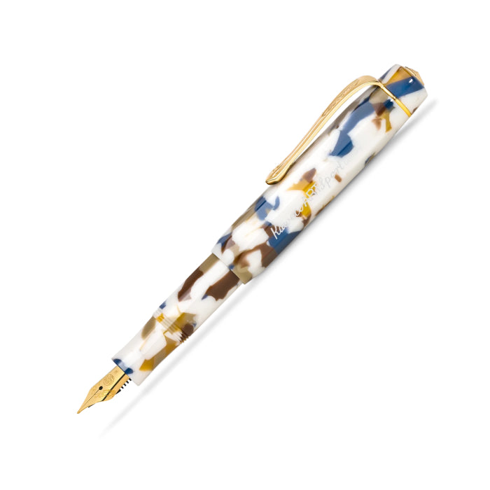 kaweco fountain pen with a marbled resin body in white, gold, and navy blue, featuring a polished gold clip and end cap.
