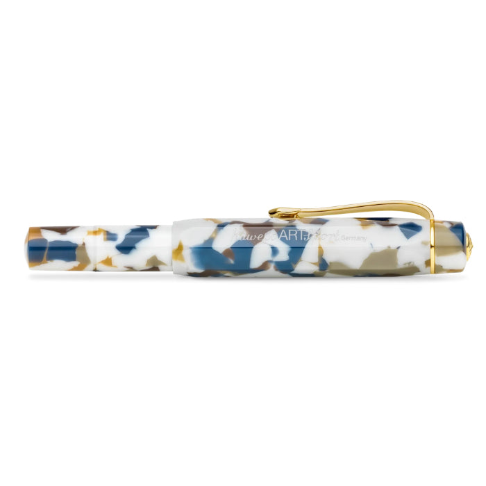 A luxury pen with a marbled resin body in white, blue, and gold, featuring a polished gold metal clip and trim, set against a plain white background.