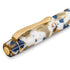 A close-up of a fountain pen with a marbled resin body in white, gold, and navy blue, featuring a polished gold clip and end cap.