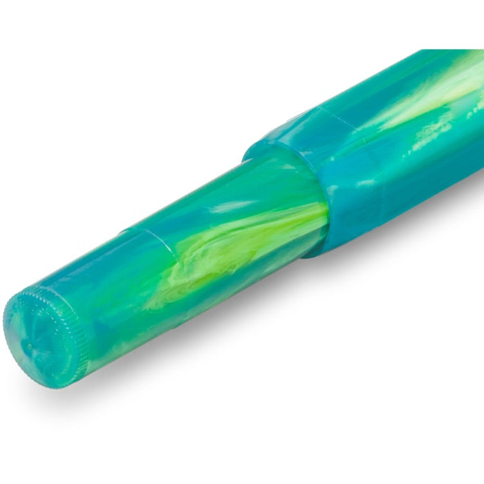 A close-up of a translucent green and blue pen or marker tip with a swirled marbled pattern, shown on a white background.