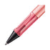 Pink pen with a black cap on a white background
