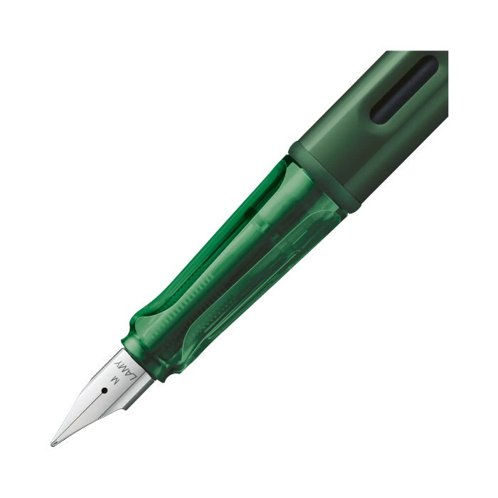 Green fountain pen on a white background