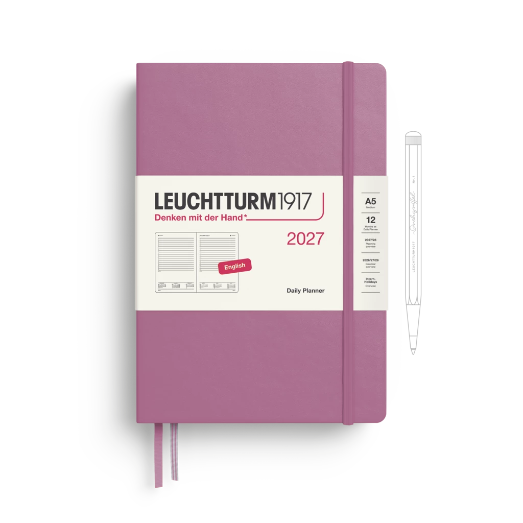 A Leuchtturm1917 2027 daily planner in dusty purple with a white paper band around the middle, shown on a white background with a pen outline to the right.