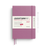 A Leuchtturm1917 2027 daily planner in dusty purple with a white paper band around the middle, shown on a white background with a pen outline to the right.
