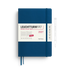 A Leuchtturm1917 2027 daily planner in indigo blue with a white paper band around the middle, shown on a white background with a pen illustration to the right.
