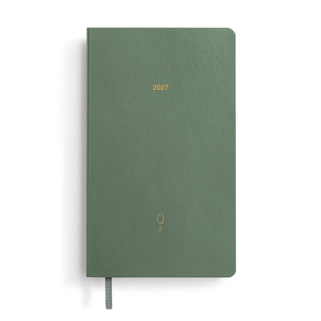 Green notebook with '2027' printed on it against a white background