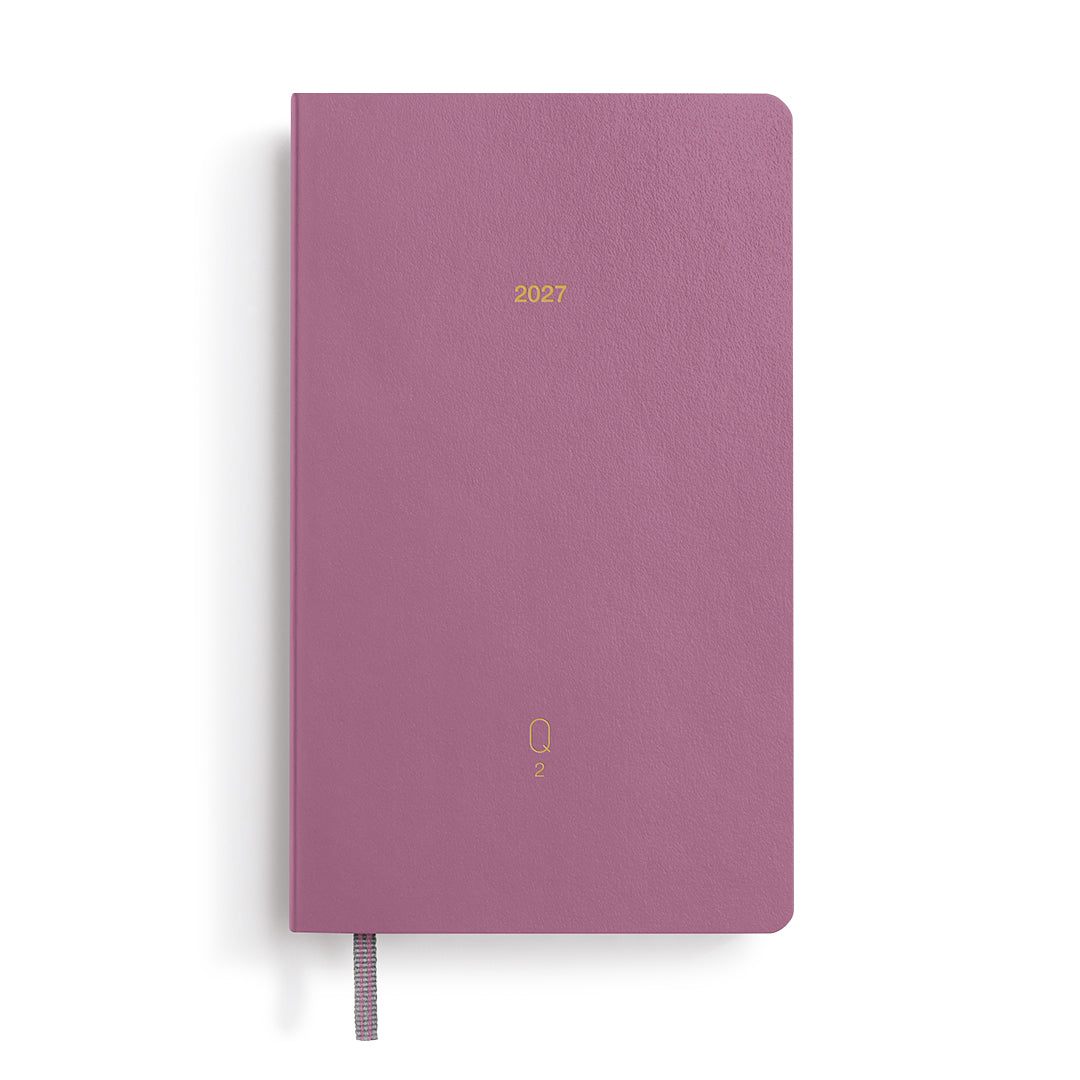 Purple notebook with '2027' printed on it against a white background