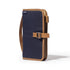 Navy blue and brown bag with a strap on a white background