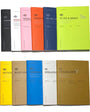 Set of colorful notebooks with various designs on a white background
