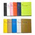 Set of colorful notebooks with various designs on a white background