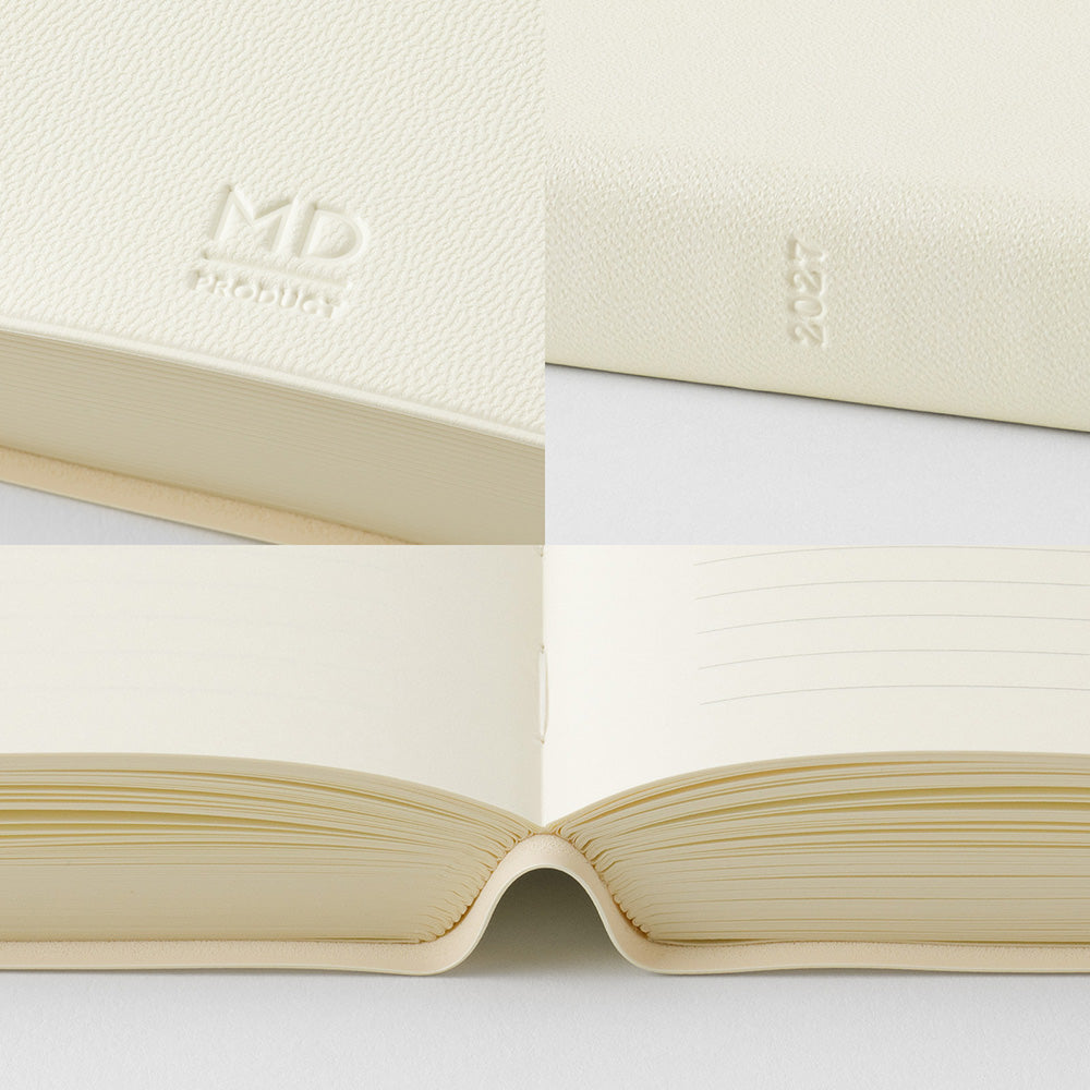 An open cream-colored leather-bound notebook or journal shown in a close-up collage, with embossed 'MD FASHION' and '2027' visible on the cover, plus lined interior pages.