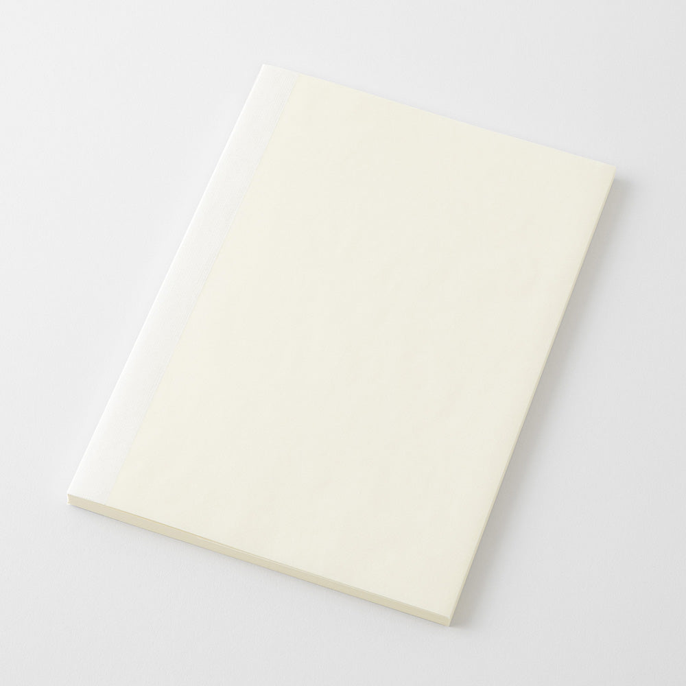A blank cream-colored notebook or journal with a white binding edge, shown at an angle on a light gray background.