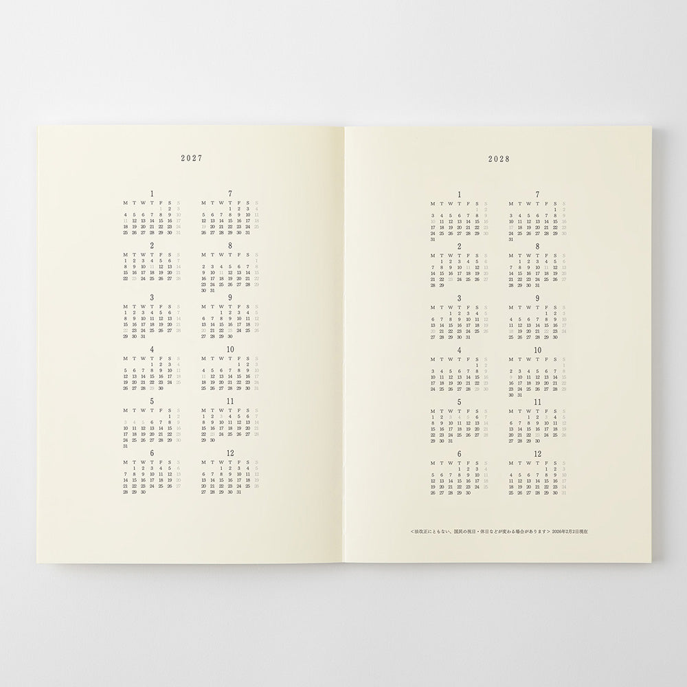 An open two-page calendar spread showing the years 2027 and 2028 in a minimalist black grid format on warm cream paper, photographed against a light gray background.