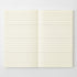 An open cream-colored ruled notebook or journal with horizontal lines, displayed flat against a light gray background.