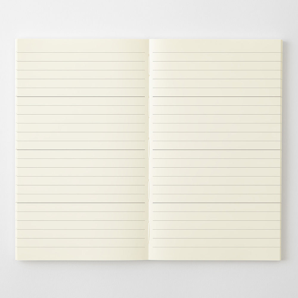 An open cream-colored ruled notebook or journal with horizontal lines, displayed flat against a light gray background.