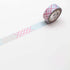 Roll of decorative tape with a pattern on a white background