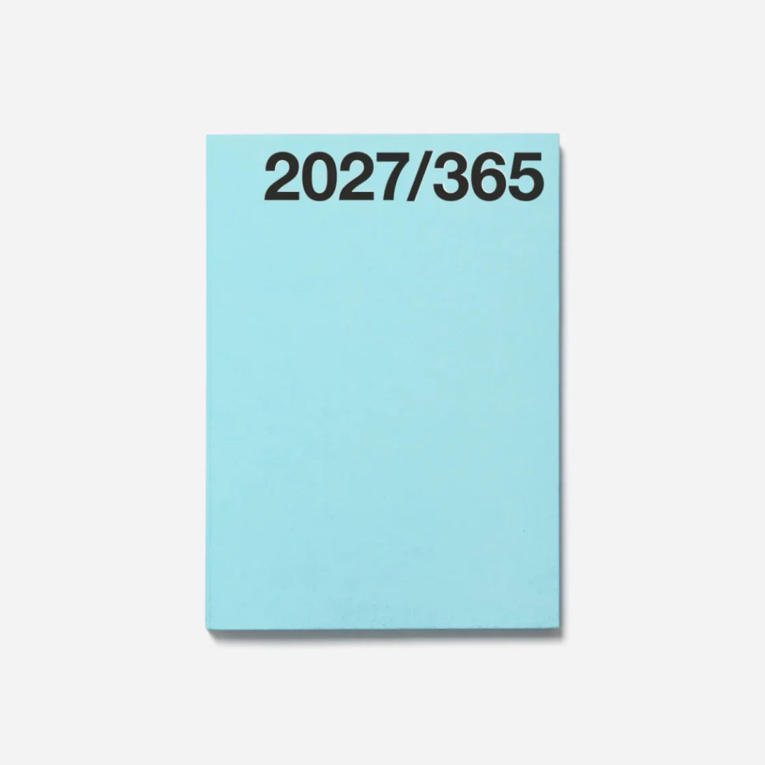 A light blue rectangular notebook or planner cover with the black text '2027/365' printed at the top, shown against a plain light gray background.