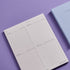 Planner with checklists on a purple background