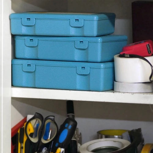 Stack of blue toolboxes on a shelf with various tools and equipment around.