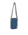 Blue crossbody bag with a gray strap on a white background