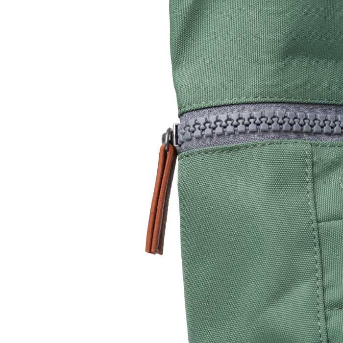 close up of zip frost coloured backpack on a white background