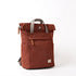 Brown backpack with gray straps on a white background