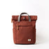 Brown backpack with gray straps on a white background