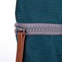 zip close up of teal coloured backpack