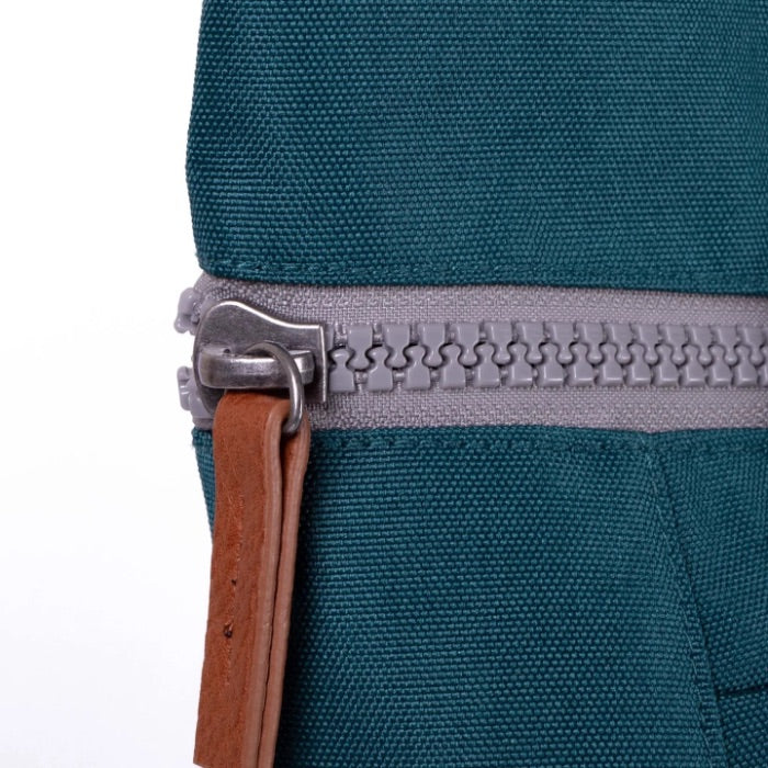 zip close up of teal coloured backpack