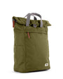 moss coloured backpack in front of a white background