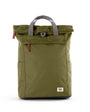 moss coloured backpack in front of a white background