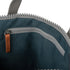 interior of dark grey coloured backpack on a white background