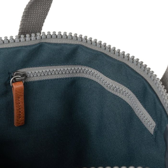 interior of dark grey coloured backpack on a white background