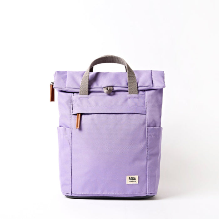 lavender coloured backpack on a white background