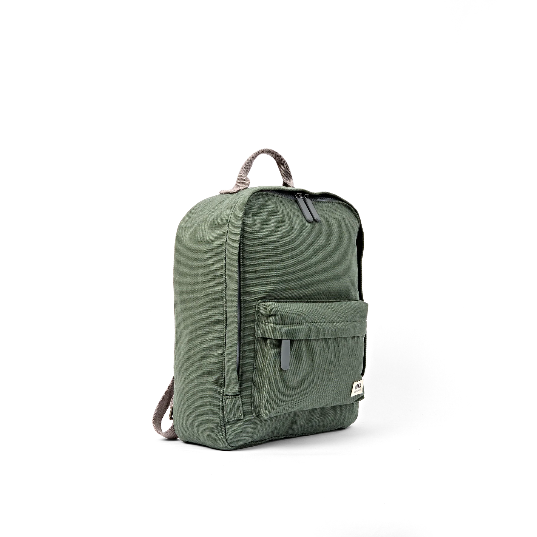 An olive green canvas backpack with a top carry handle, front zippered pocket, and dark gray straps, shown from a three-quarters angle on a white background.