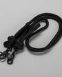 Black lanyard with two carabiners on a light gray background