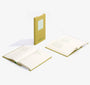 Two open notebooks with a yellow cover on a white background