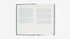 Open book with text on a white background